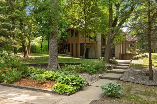 Situated on 2.24 acres, beautiful perennial gardens and mature trees surround the home.