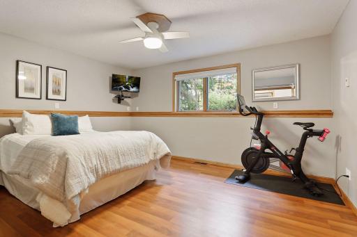 Retreat to the lower level highlighting two bedrooms, one bathroom and a laundry room.