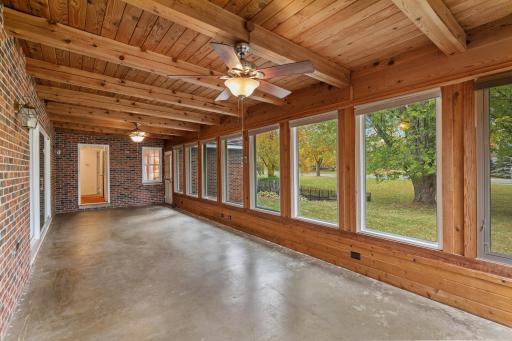 Notice the full brick wall on the interior wall of this porch. It mimics the current exterior of this home. There is a six’ patio door to this area from the dining room, and a nine’ patio door from the living room.