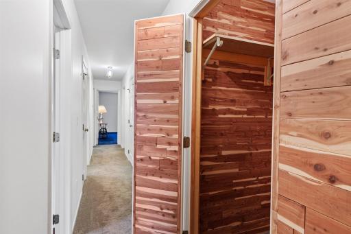 This level features three large bedrooms, a full bath, linen closet, utility closet, cedar closet and storage closet, all accessed by the hallway.