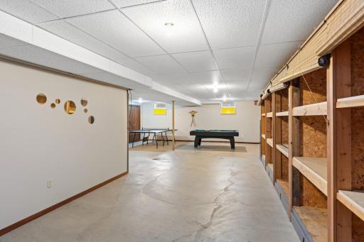 The lower level works perfectly as entertainment space, professional space and for hobbies. There is a large amusement room with three bifold closets, dropped ceilings and storage shelving.