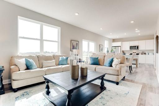 Open and bright. Imagine entertaining and living here! Model photos. Options and colors will vary.