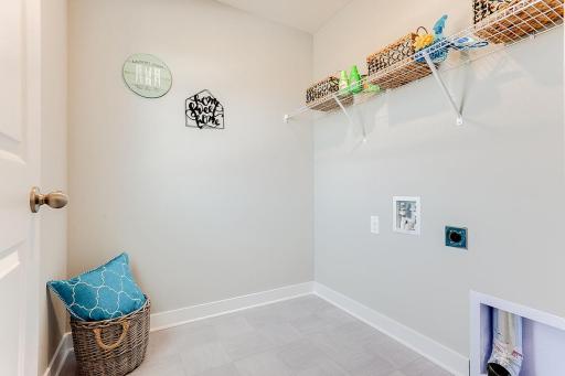 Convenient bedroom level laundry room. Model photos. Options and colors will vary.