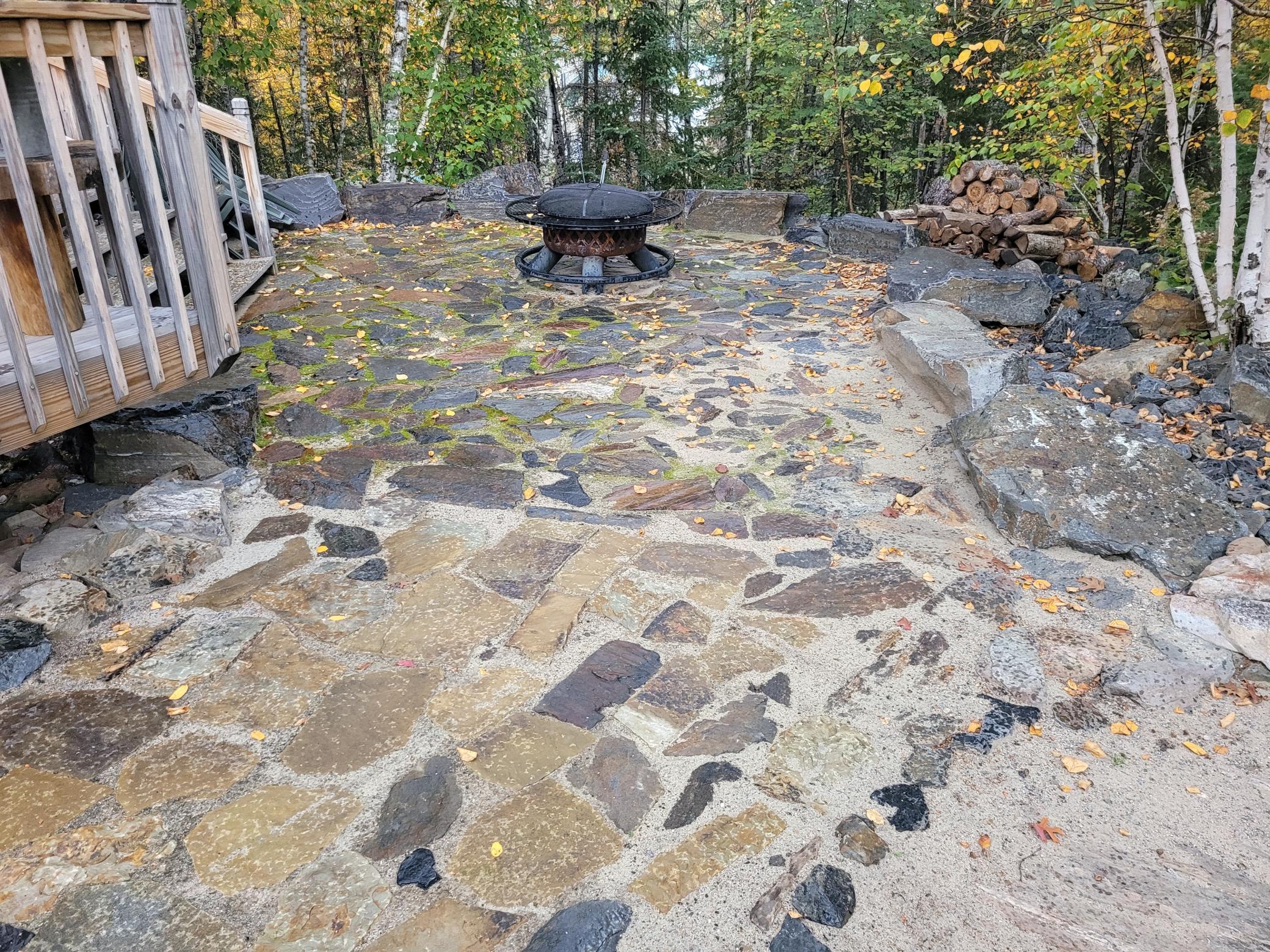 Handcrafted Rock Patio with a Built-in Fire Ring