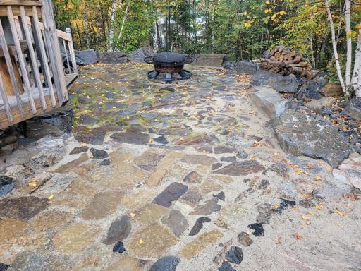 Handcrafted Rock Patio with a Built-in Fire Ring