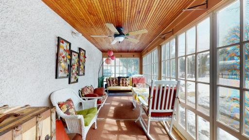 A highlight of the home is the spacious screen porch overlooking the back yard gardens