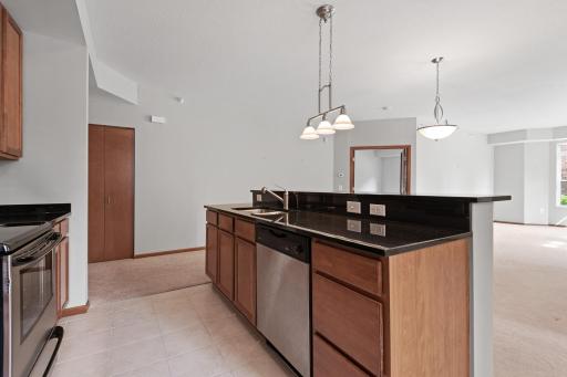 The large kitchen island provides additional counter space for meal prep.