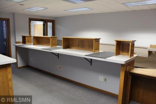 Backside of transaction desk near front entry