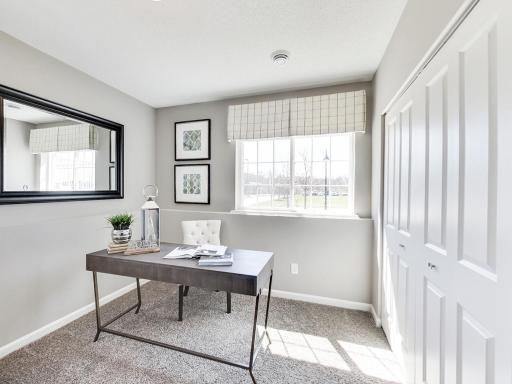 Fully finished, this lower level flex room has endless possibilities! Use it as an office, guest room, workout area, TV room, den. Photos from previous model home, finishes and options to vary.