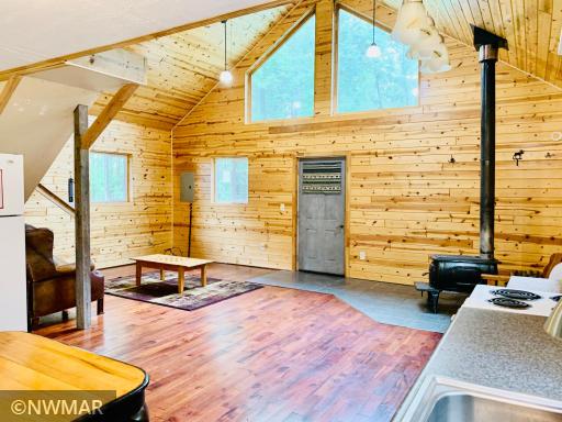 Open concept cabin with knotty tongue & groove