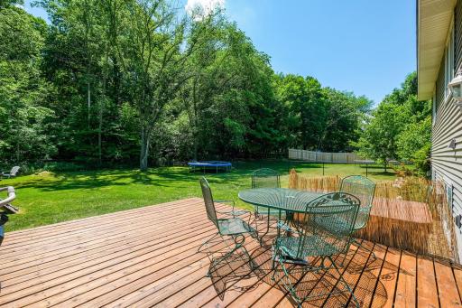 Large deck and hot tub out back in this large fenced yard.