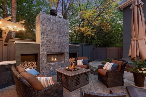 Snuggle up in front of the wood burning fireplace in the outdoor family room.