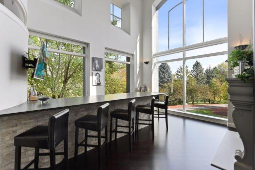 Photo for 1450 W Farm Road, Chaska, MN 55318 - Listing #6113107 The two-story bar room is the ultimate space for entertaining or enjoying a glass of wine with friends.