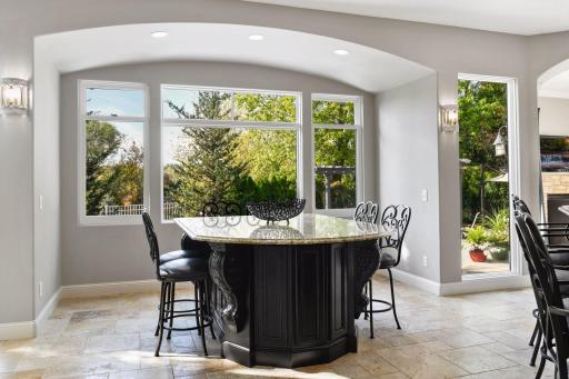 Three new windows were added to the dining room filling the space with natural light. The base of the built-in dining table is surrounded with additional storage cabinetry.