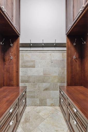 An alcove in the mud room offers built-in lockers, storage drawers and coat hooks.