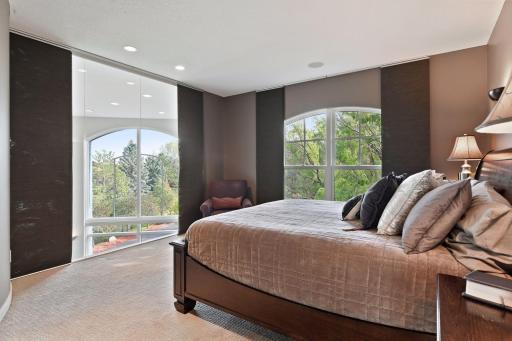 A private retreat - the master suite is a beautiful space with large windows that provide impressive views out over the treetops. You can even enjoy the fireworks from Valley Fair.