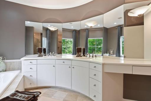 Photo for 1450 W Farm Road, Chaska, MN 55318 - Listing #6113107 The comfort height vanity offers two sinks and a built-in linen cabinet.