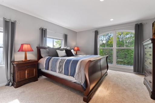 The third junior bedroom enjoys views of the pool and backyard patios.