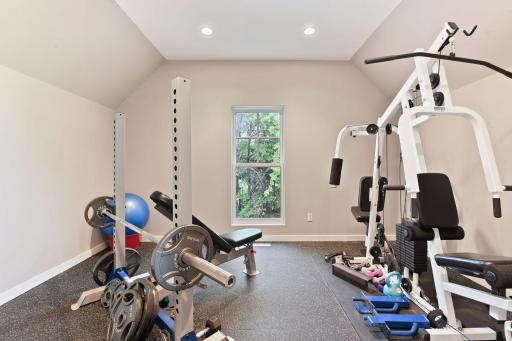 The exercise room features rubber gym flooring.