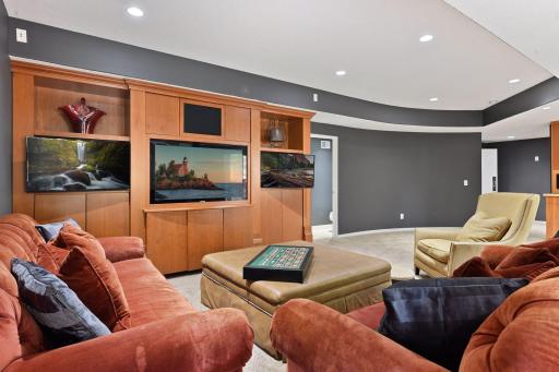 Photo for 1450 W Farm Road, Chaska, MN 55318 - Listing #6113107 The sellers added the built-in entertainment center to the lower level with cabinetry for your audio visual components and additional TVs - perfect for playing video games or following your favorite sports teams!