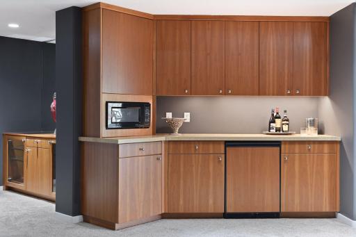 Photo for 1450 W Farm Road, Chaska, MN 55318 - Listing #6113107 A walk-up bar features a beverage refrigerator and microwave so that you can keep your snacks and drinks handy for movie night or entertaining.