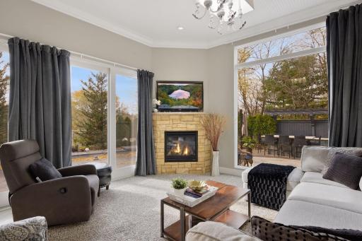 Photo for 1450 W Farm Road, Chaska, MN 55318 - Listing #6113107 Just off the kitchen is the family room. Converted from a screen porch, this family room enjoys floor-to-ceiling windows and sliding patio doors that open out to the pool and patios.