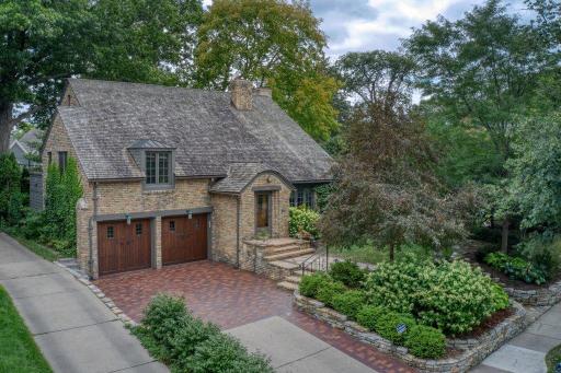 All brick, English Cottage style home just steps from Lake Bde Maka Ska and Minnetonka Country Club. The home features beautiful carriage-style garage doors and a brick driveway