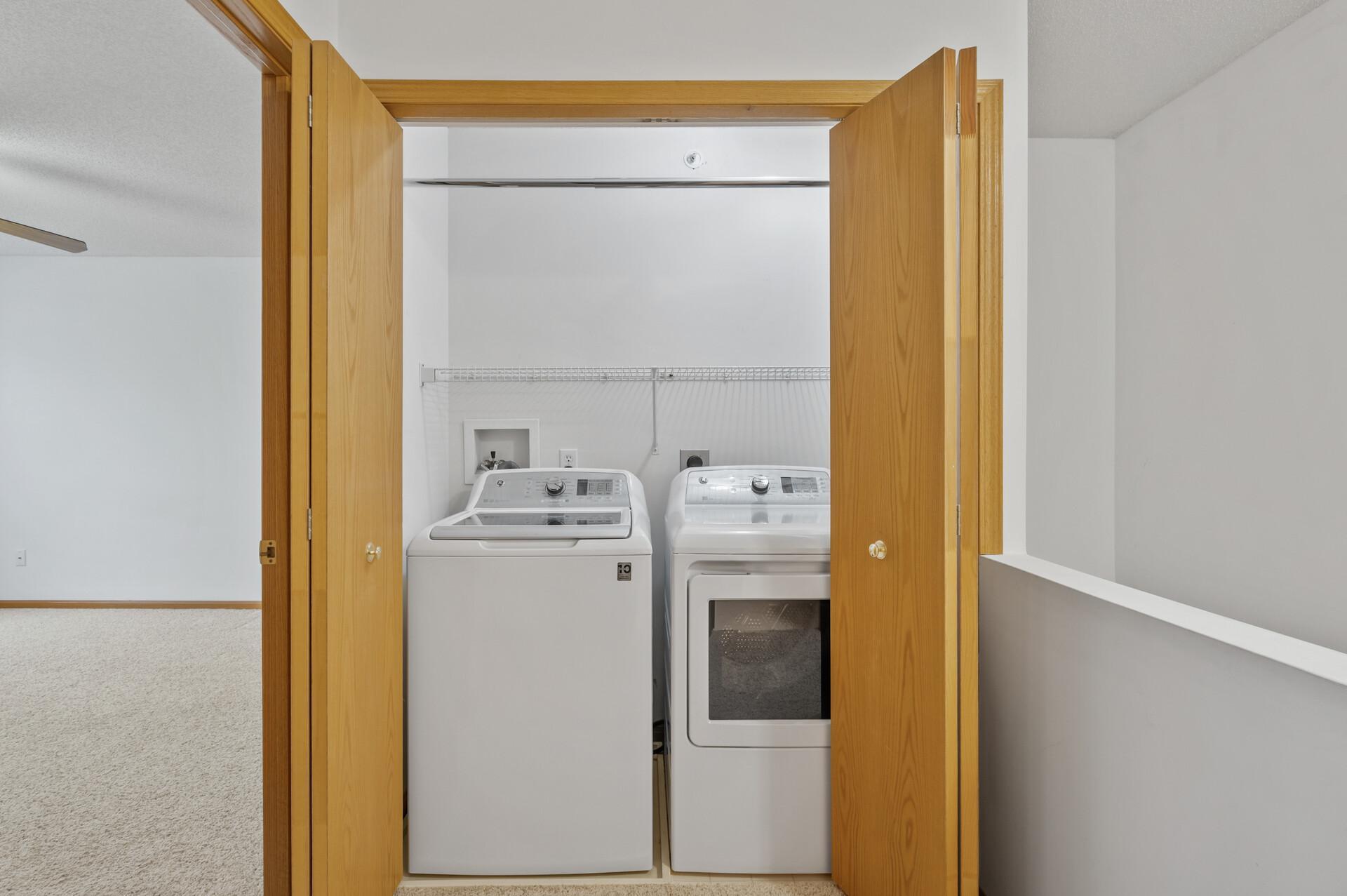 Upper level laundry facilities. Washer and dryer sold with this unit