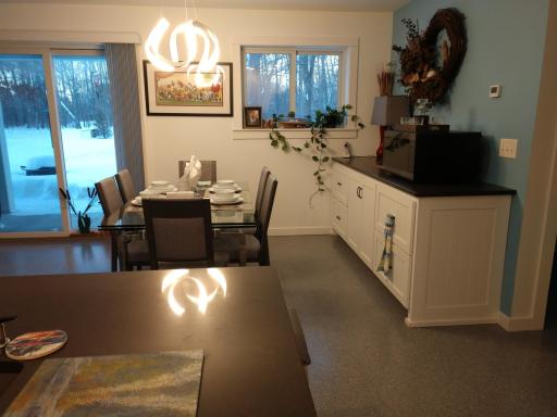 From behind the kitchen island, to the dining area, and to a great view of the outdoors; Winter or summer, the deer and turkeys, squirrels and birds, can be enjoyed from inside.