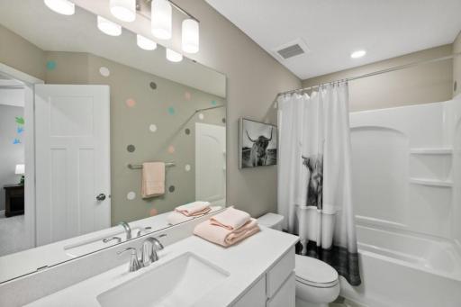 The spacious upper level secondary bath provides plenty of space for everyone to get ready during those busy mornings. (Photo of decorated model, actual home's finishes may vary slightly)