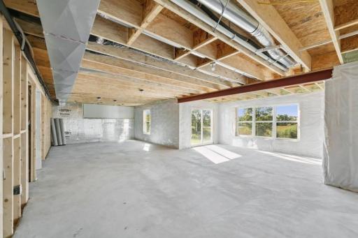 The huge unfinished, walk out lower level offers a ton of future potential for a homeowner to finish post close! (Photo of decorated model, actual home's finishes may vary slightly)