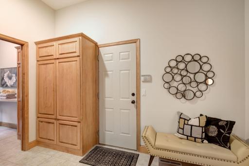 Large mudroom with built ins and a closet
