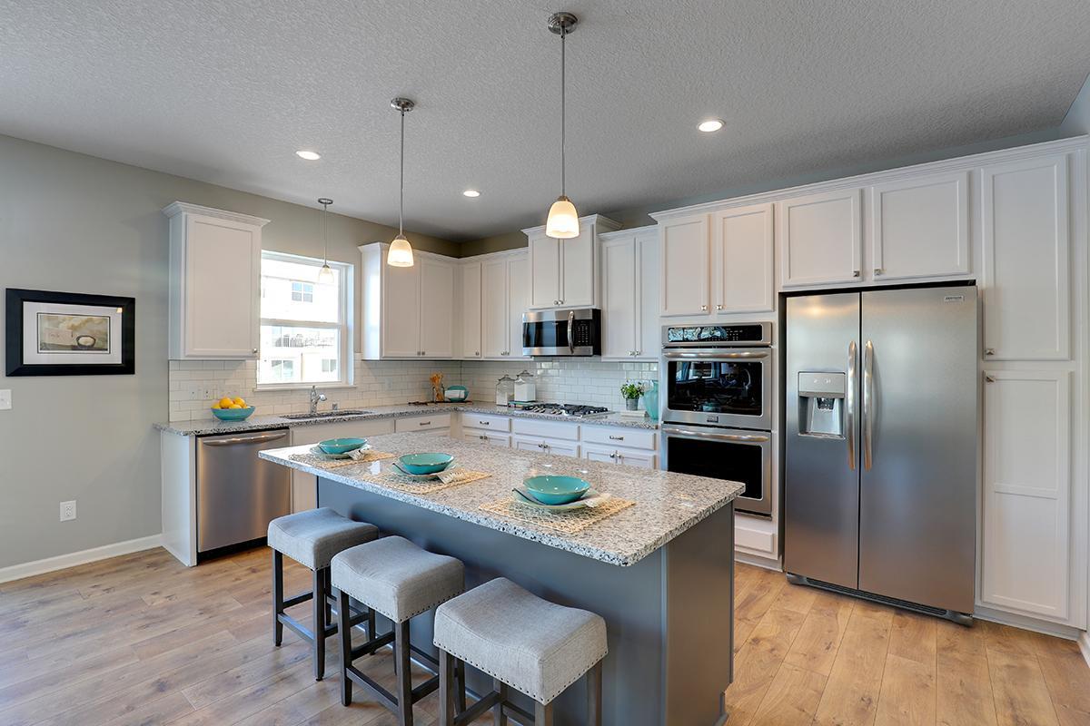 The kitchen of your dreams awaits!! With double ovens and a five burner stove, plan to host all the family gatherings! Photo of model, colors and options will vary.