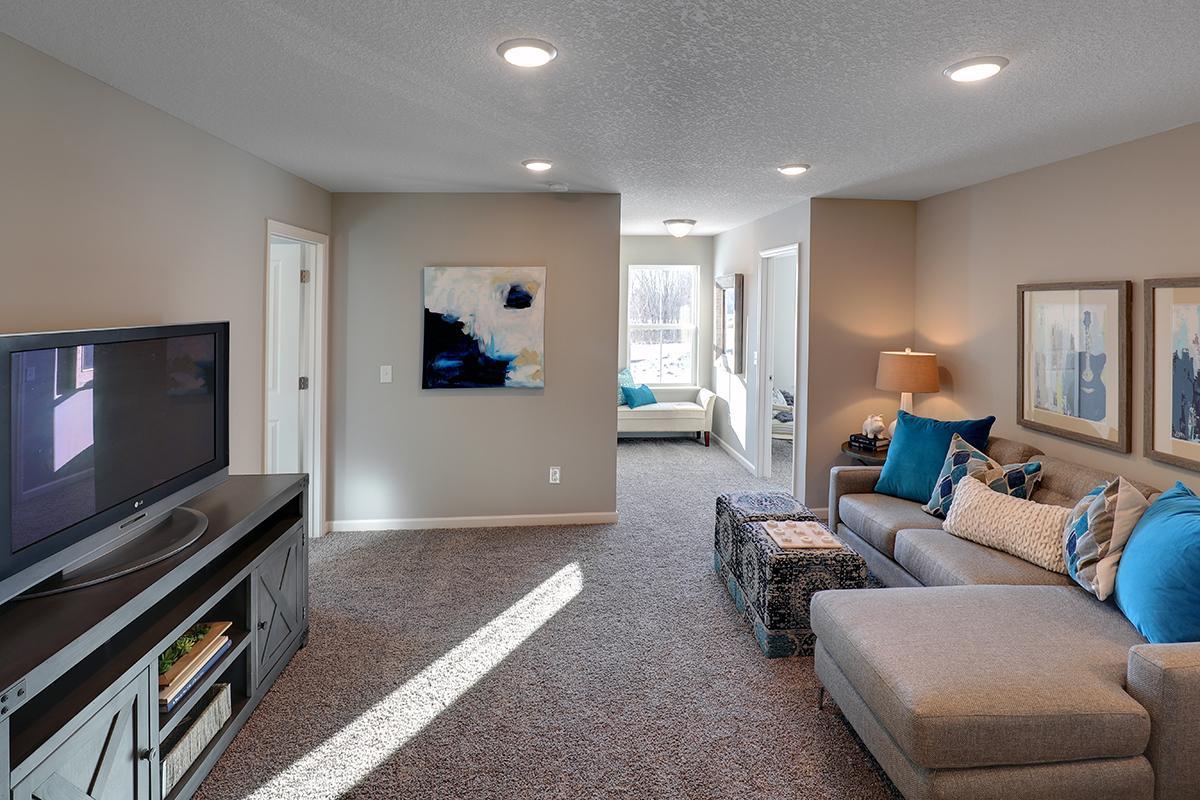 Once upstairs, the entire level flows from the focal point offered by this huge loft space. Sure to become a family favorite hangout spot! Photo of model, colors and options will vary.