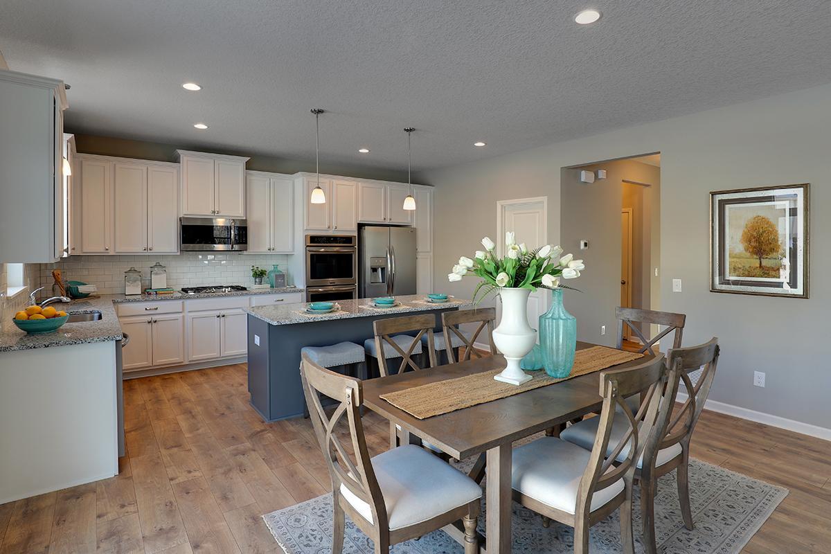 The kitchen space leads straight into the dining area, which stretches 17-feet across and leaves enough space to accommodate any dining table configuration! Photo of model, colors and options will vary.