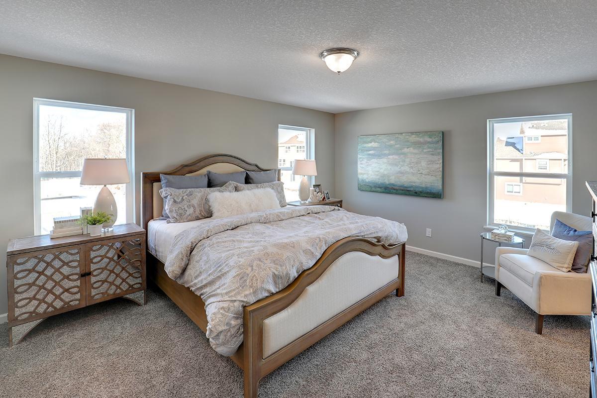 The home's primary suite is awesome and loaded - filled with natural light from all the windows! Photo of model, colors and options will vary.
