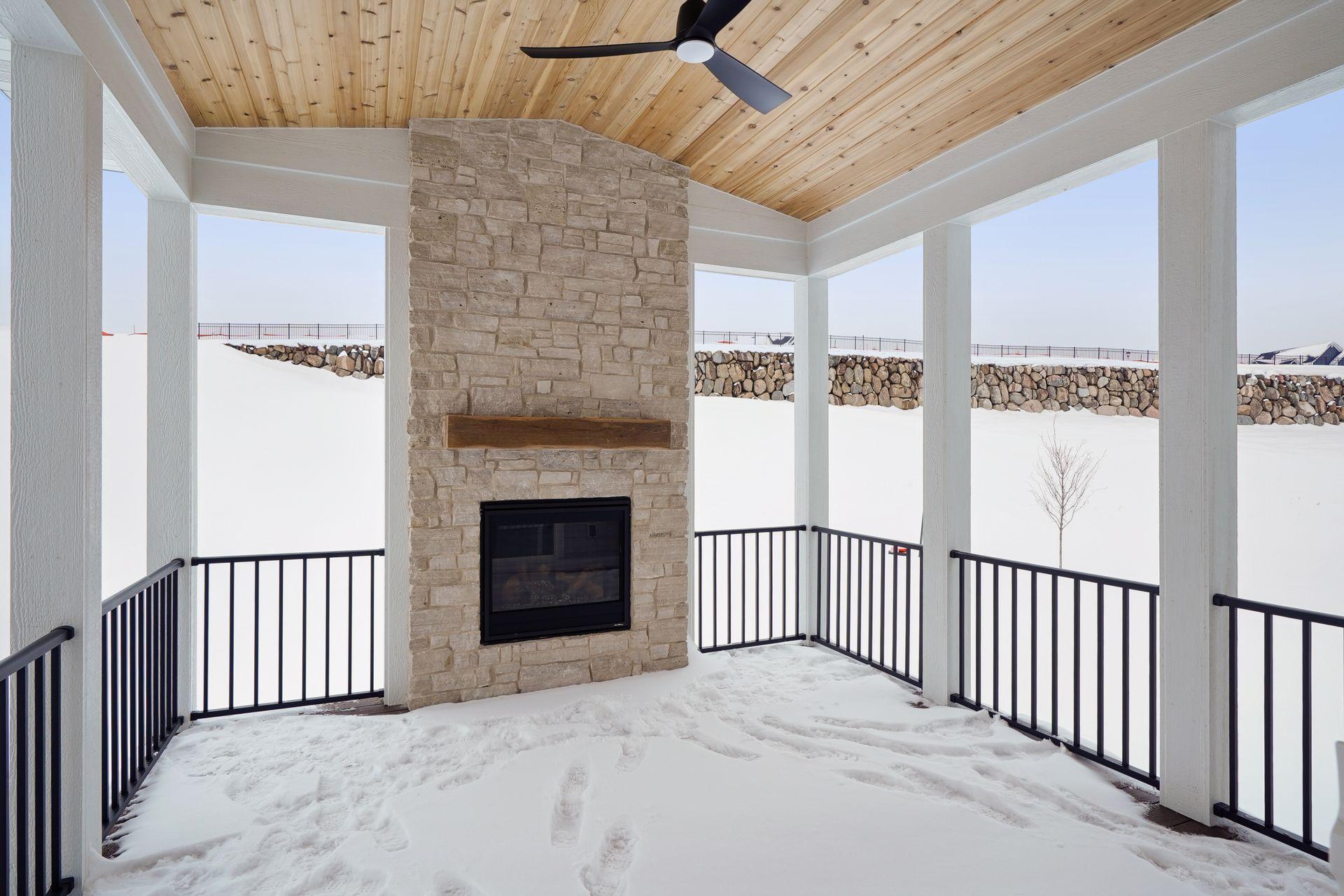 3-season, composite decking, stacked stone fireplace to ceiling, Sunspace windows still coming