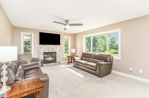 Gorgeous fireplace and updated flooring in roomy family room