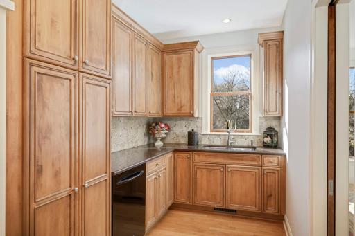 The butler's pantry offers additional counter space, cupboard space, an additional dishwasher, and another sink.