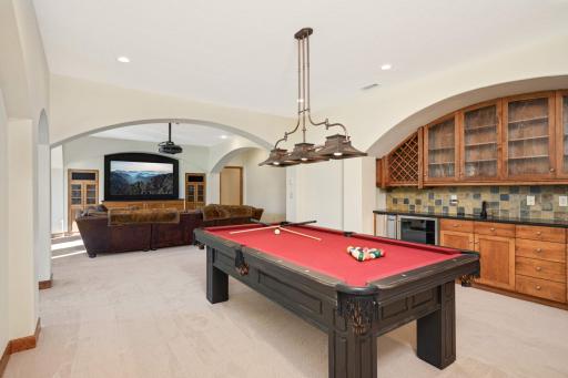 The sizable bar area easily accommodates a pool table.