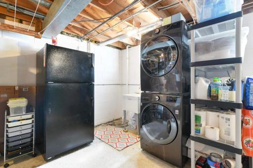 Laundry area is clean and bright and comes with a beverage fridge!