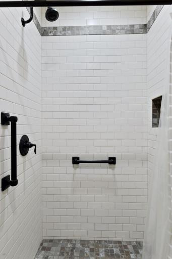 Beautiful new shower with milk glass tile surround shower