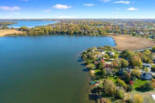 Full recreational lake in Waconia! A must see custom built lake home with 110 feet of level sandy lakefront on nearly an acre lot.