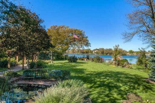 Looking for more outdoor space? This yard has it all. Pergola, flag pole, boat house, firepit, sandy lake front, yard to play with dog or friends. Imagine all the options you have here....