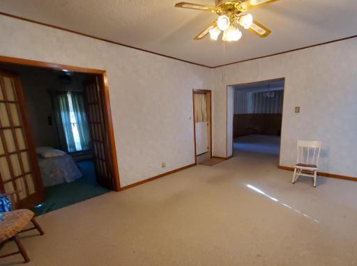 Photo for 225 2nd Street NE, Pipestone, MN 56164 - Listing #6117194 Living room with french doors to main floor bedroom