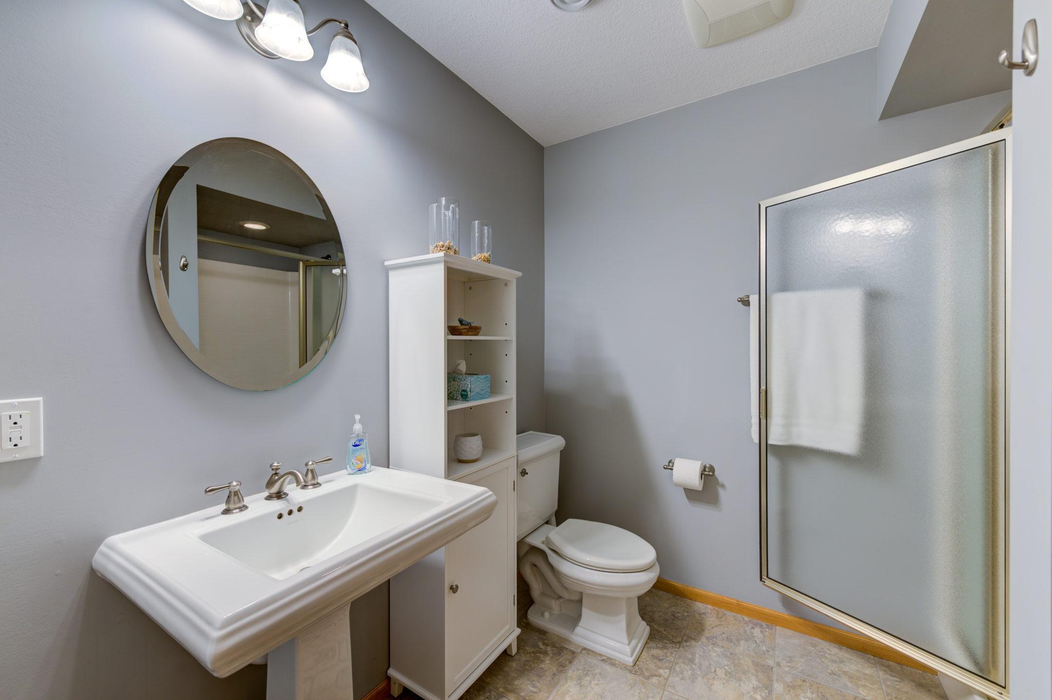 The lower level 3/4 bath offers a walk-in shower as well as a nice size linen closet.