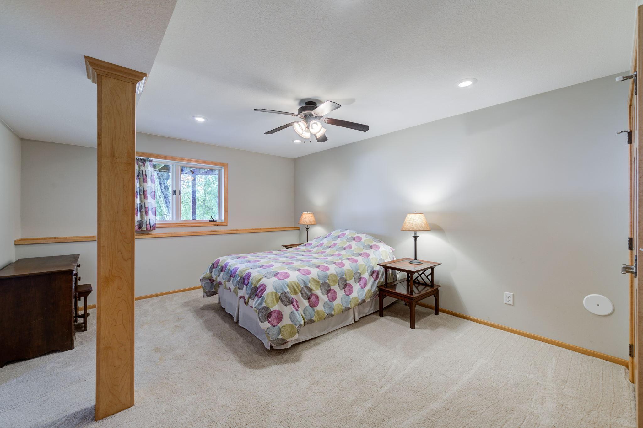 The lower level bedroom is very spacious at 17x14 with a large closet featuring french doors with plenty of storage space!