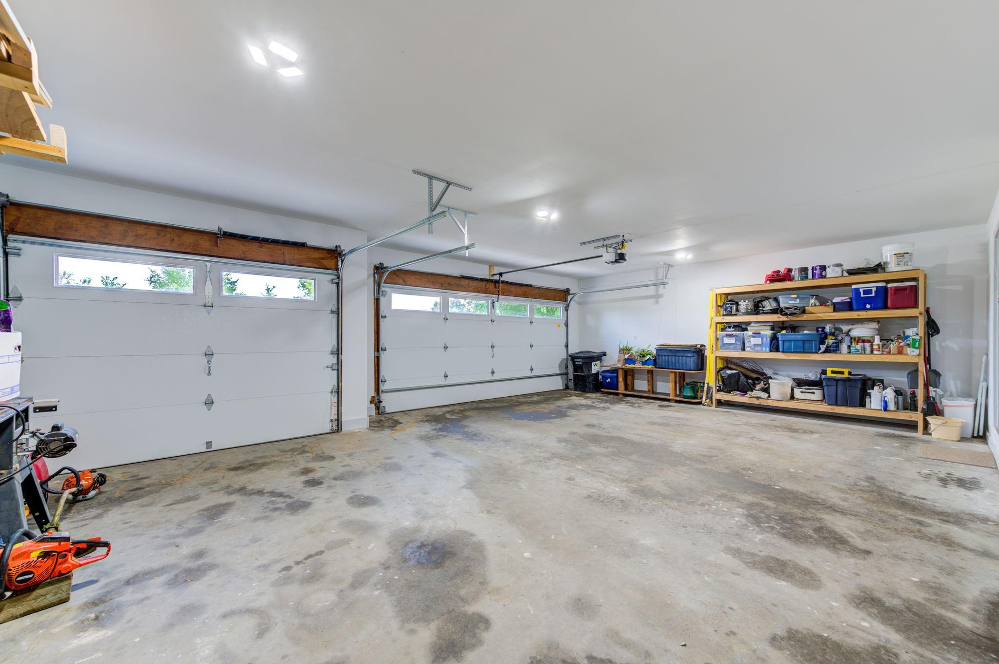 The large three stall attached garage is insulated and finished offering plenty of storage space for vehicles, tools and toys while at the lake!