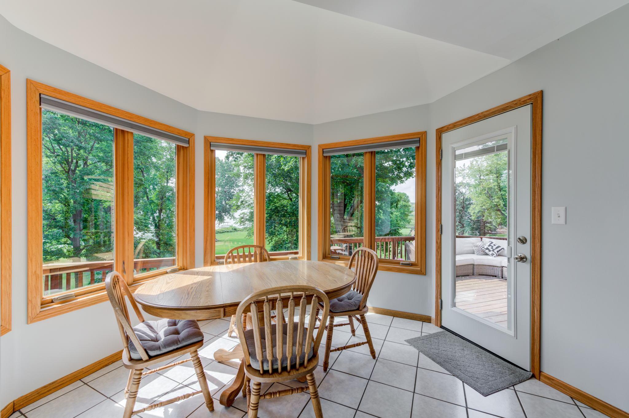 The informal dining room will quickly become one of your favorite spots in the house with the wall of windows lakeside to take in the natural beauty that this French Lake property has to offer!
