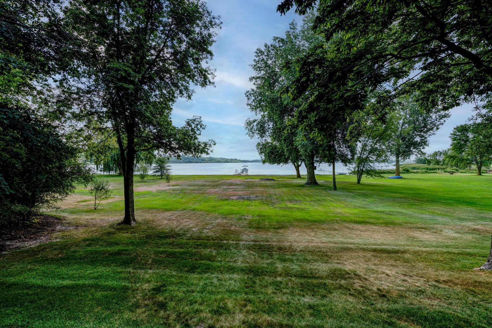 You will fall in love with the gentle slope of the yard down to the lake. There is so much usable space with this property!